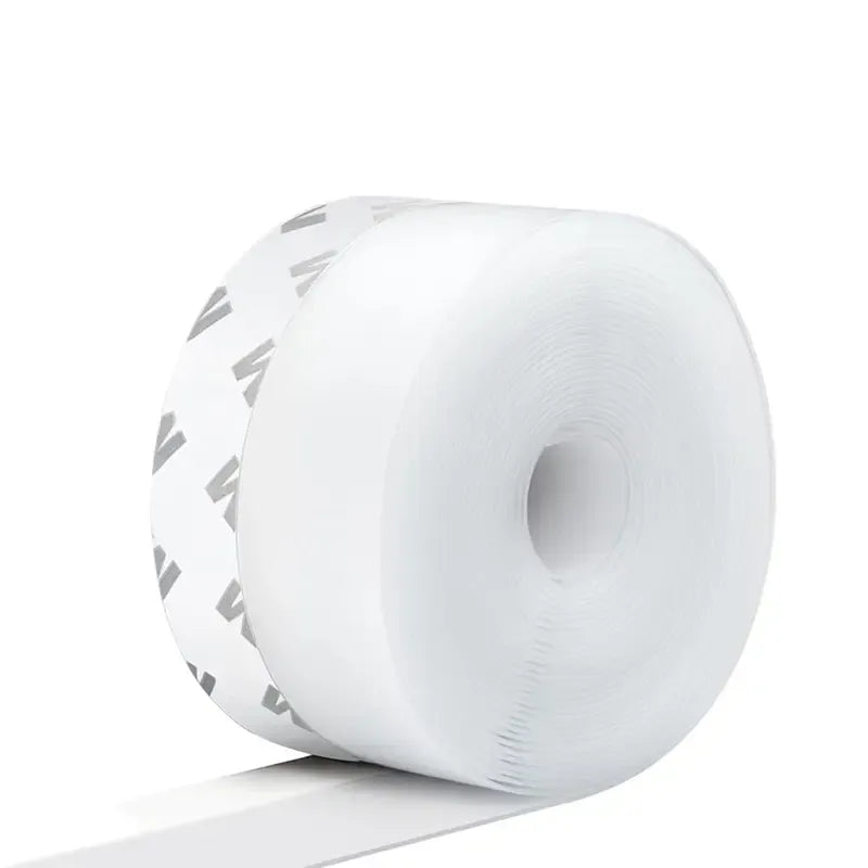 Adhesive weather stripping sealing a door gap