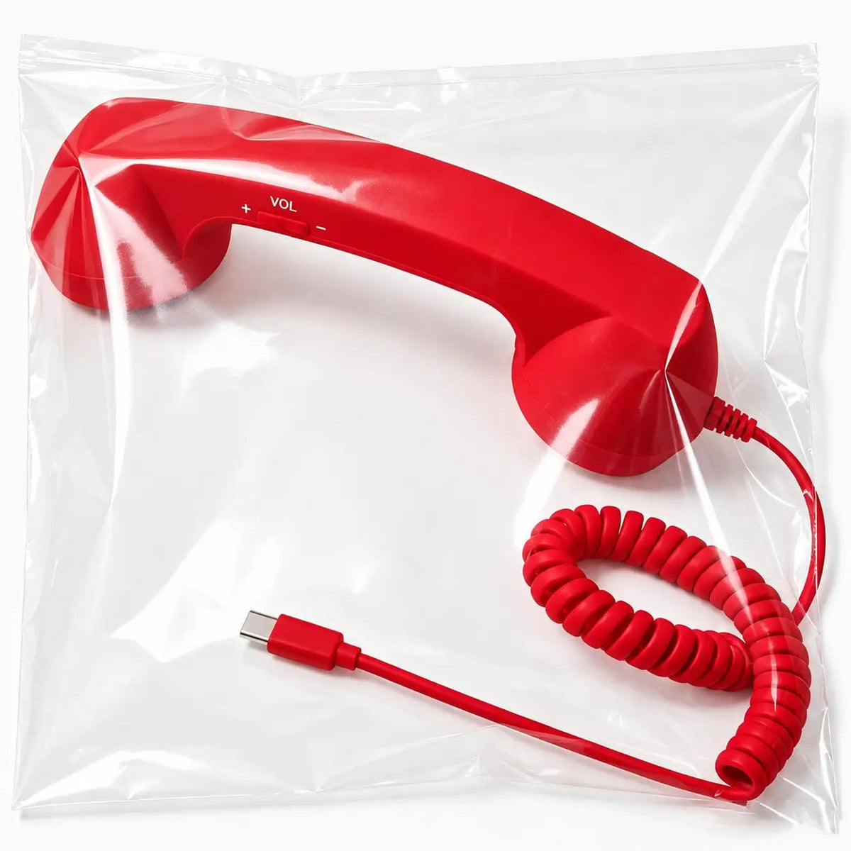 Single red wired retro handset with Type-C connector shown inside its protective plastic bag