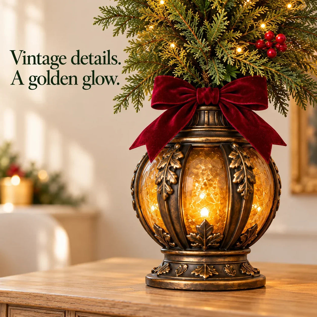 Ornate bronze-look glowing lantern base with burgundy bow