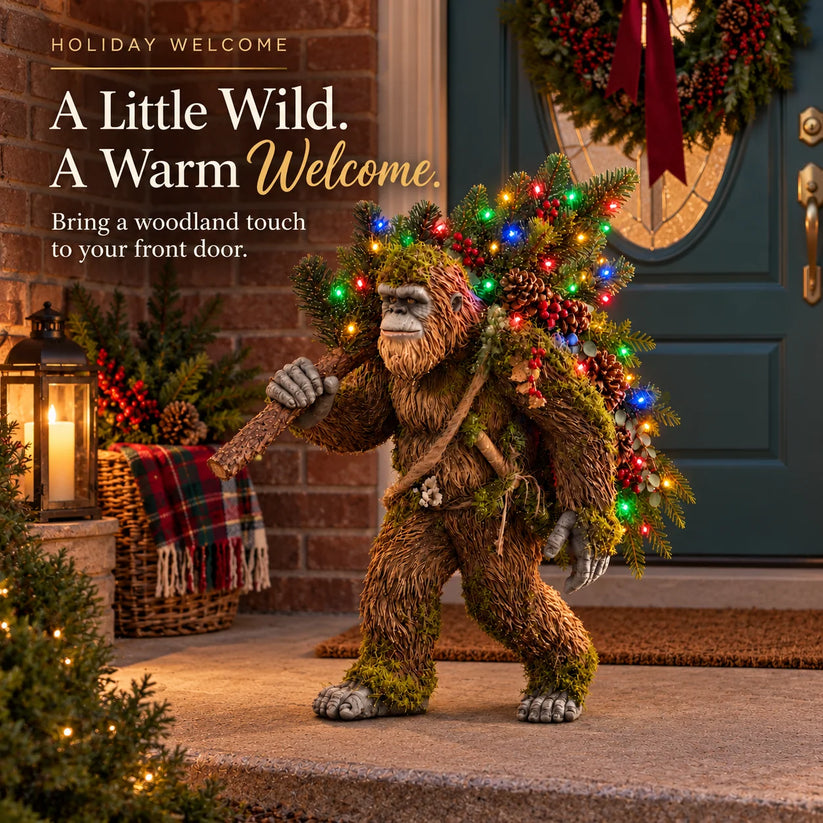 Lighted Bigfoot Christmas decoration greeting guests beside a festive front door