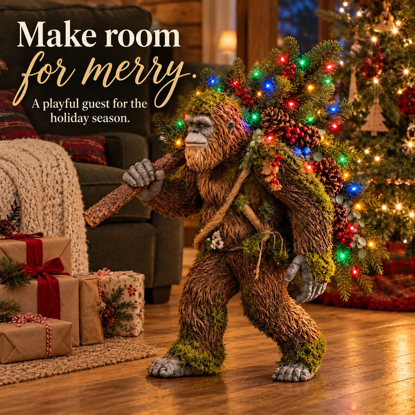 Festive Bigfoot decoration displayed next to a Christmas tree and wrapped presents