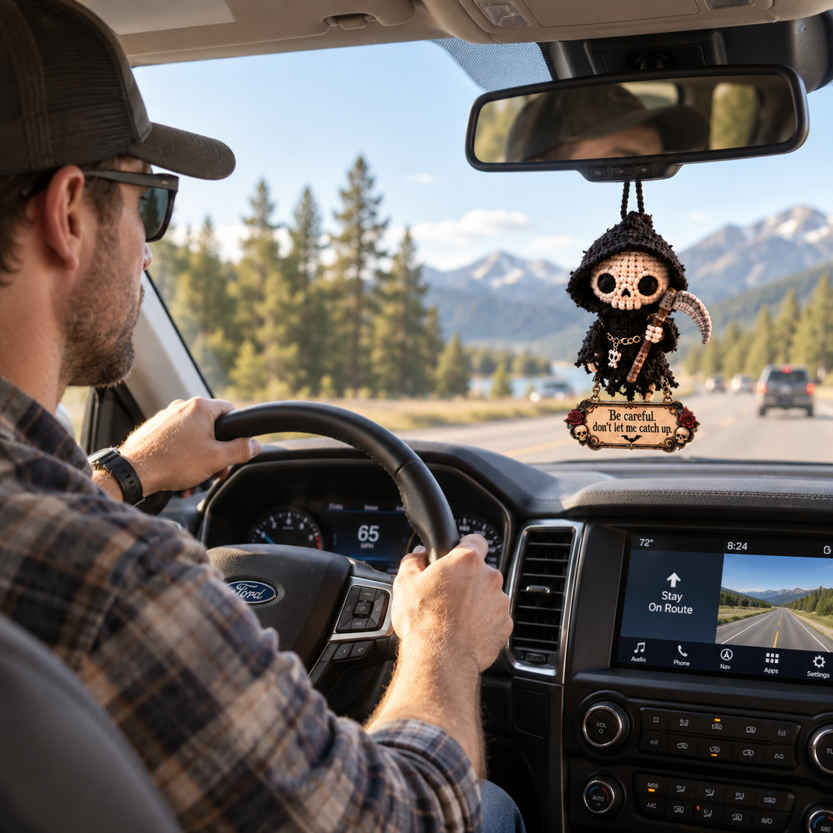 Grim Reaper hanging charm displayed inside a car