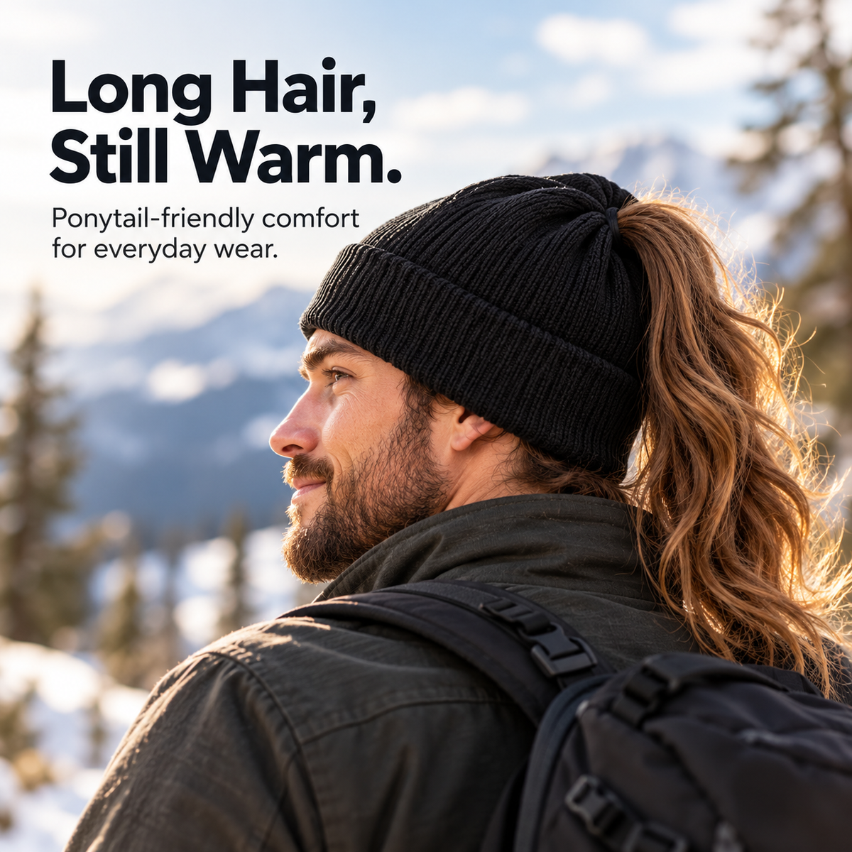 Long-haired man enjoying a snowy outdoor walk while wearing a black ponytail beanie