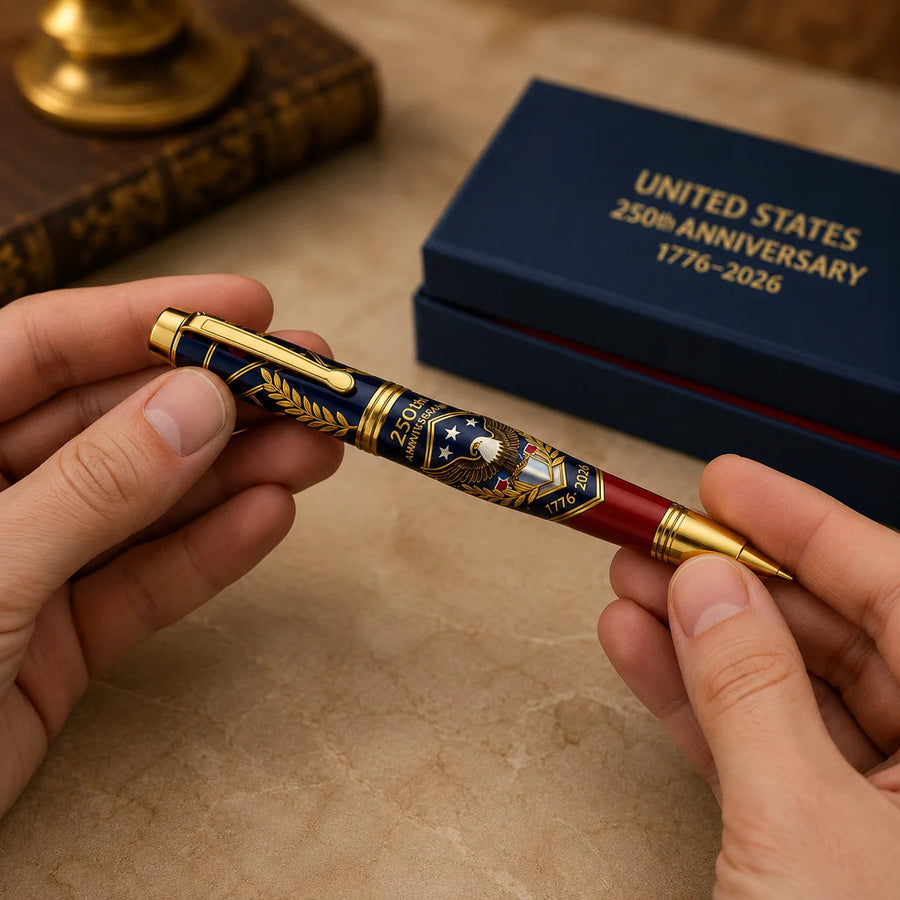 Commemorative pen held in hands as a gift