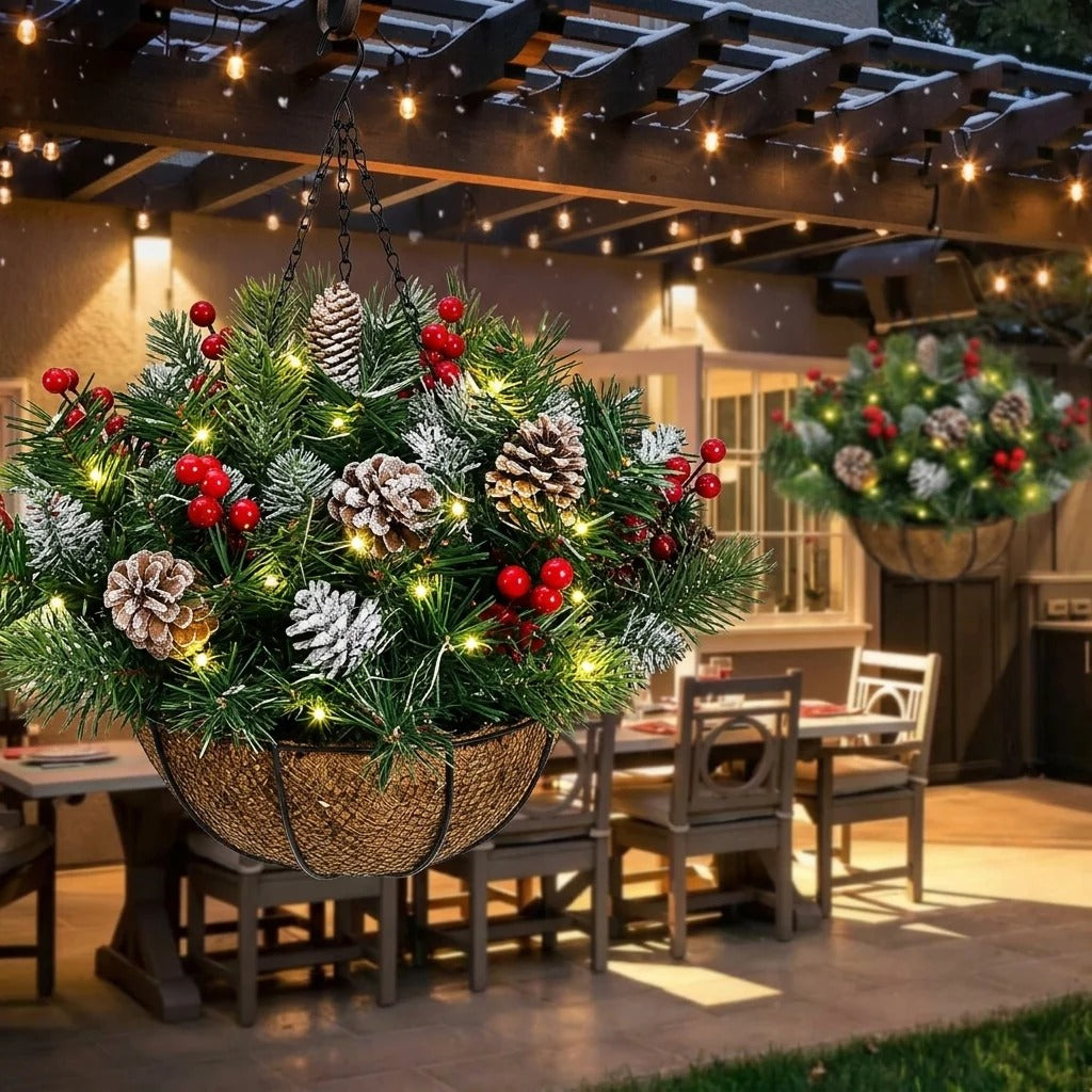 Pre-lit Christmas hanging basket with evergreen foliage, red berries and frosted pinecones