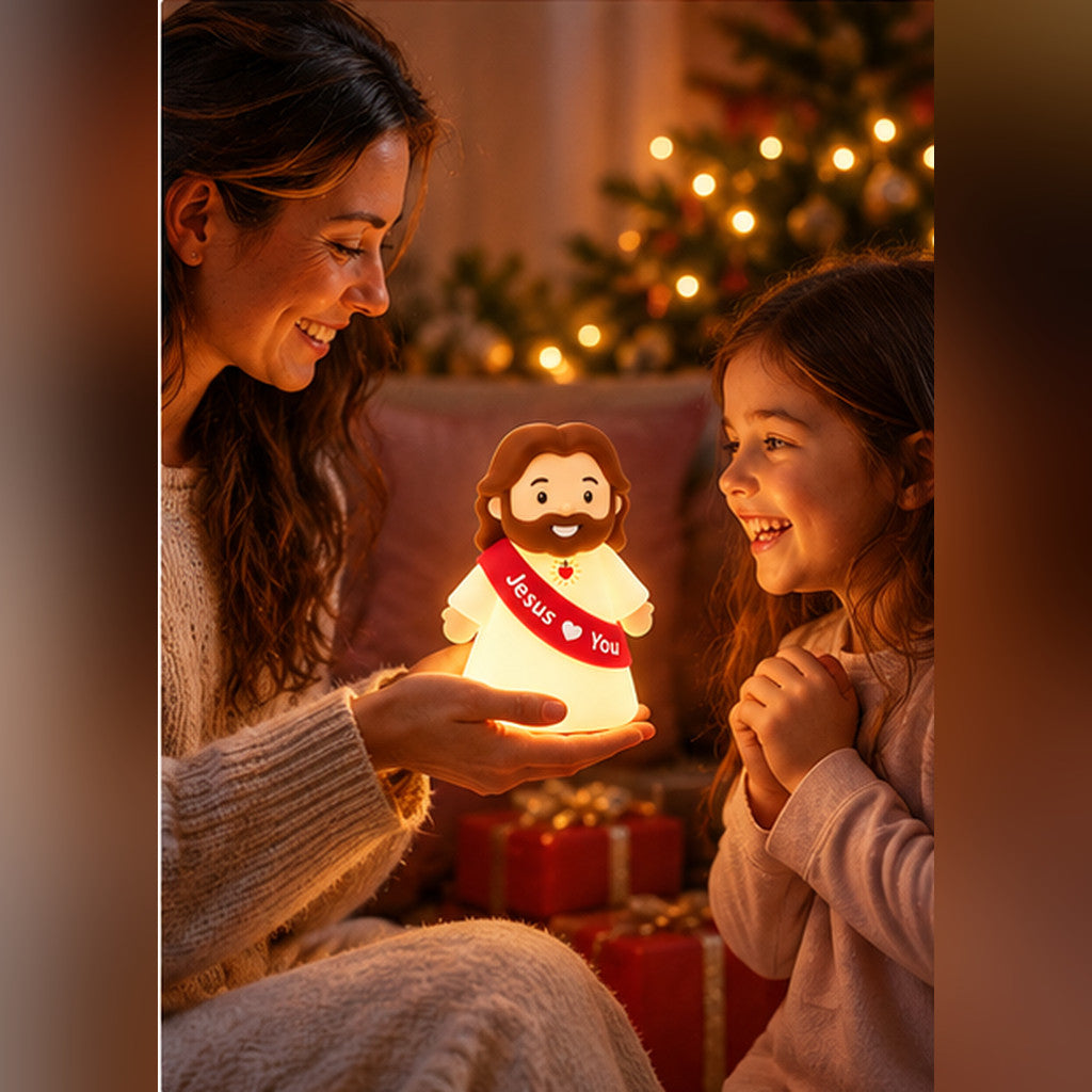 Mother sharing the glowing Jesus Loves You night light with her smiling daughter